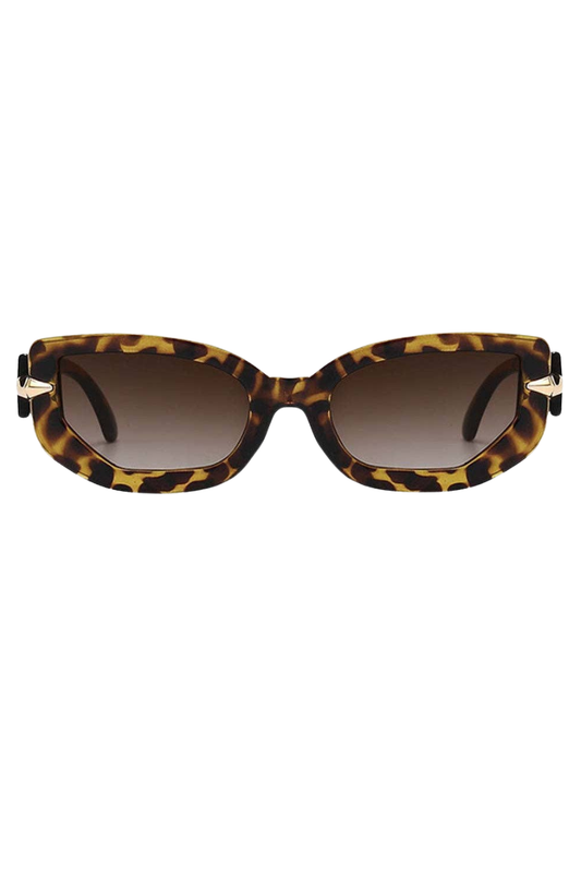 Sunglasses with tortoiseshell frame and brown gradient lenses on a white background