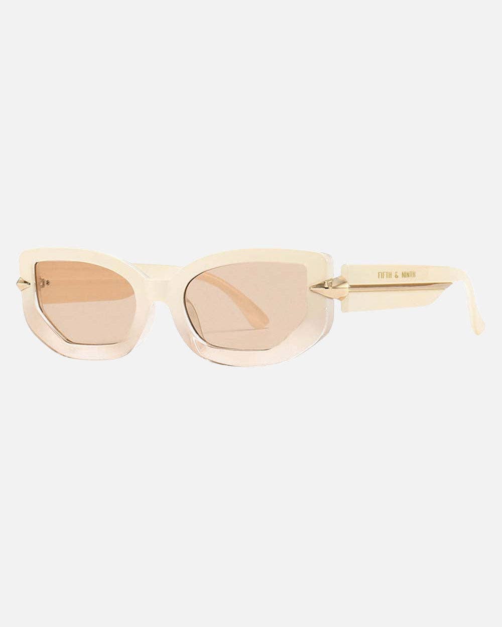 Gold cat-eye sunglasses on a white background